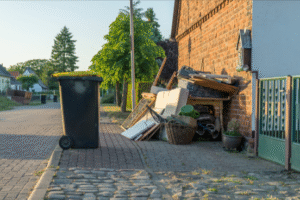 Professional junk removal Brooklyn team from MAC Junk Removal Services clearing a cluttered residential garage in Williamsburg.