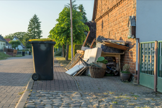 Professional junk removal Brooklyn team from MAC Junk Removal Services clearing a cluttered residential garage in Williamsburg.
